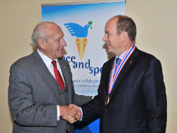 Prince Albert II of Monaco (right) receives the International Honorary Doctorate from Academy President and CEO Dr. Thomas P. Rosandich